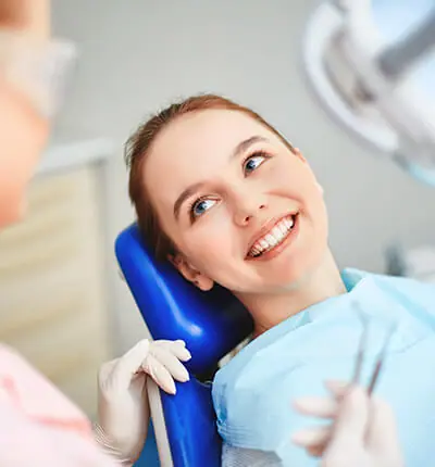 A Girl Smiling In Dental Care